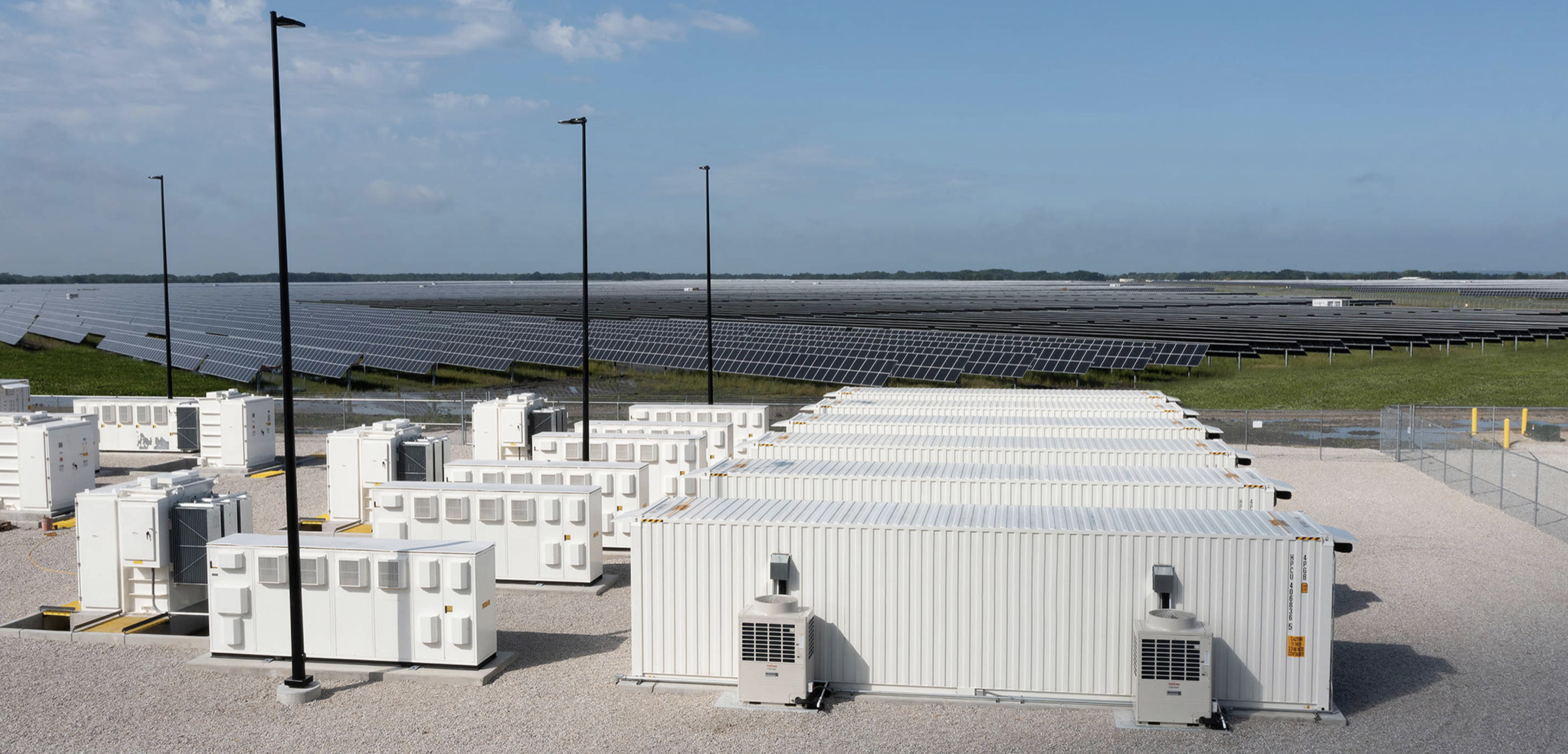 Battery storage containers and solar arrays in an ADI-published Tušimice BESS image